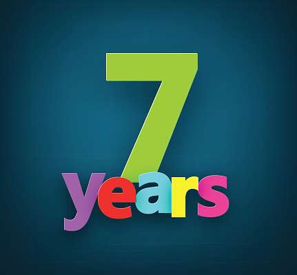 Seven years paper colorful sign over dark blue. Vector illustration. 