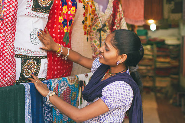 istock Indian girl choosing material 483498100