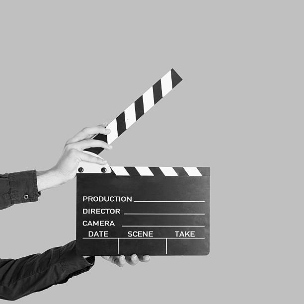 istock Man holding a movie clapperboard 483503096