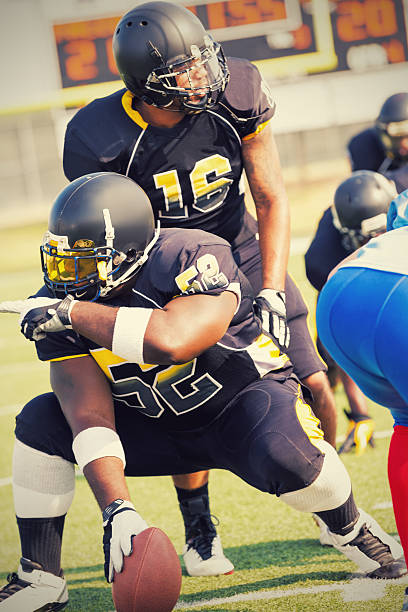 istock Football player calling play during professional ball game 483503691