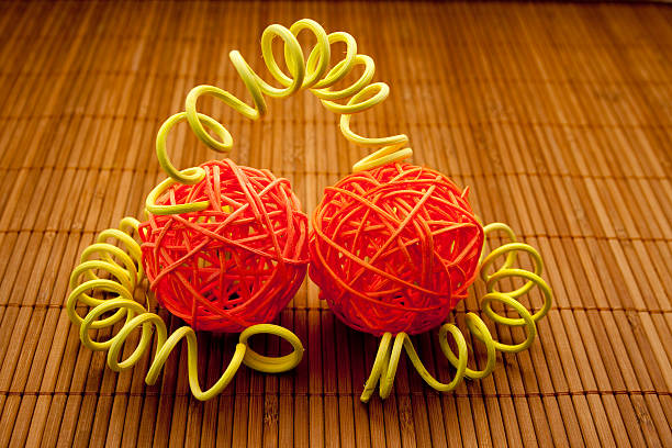 Wooden ball with spiral on wood background