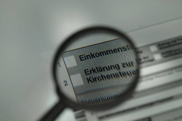 istock Income tax return Magnifying glass 483507408