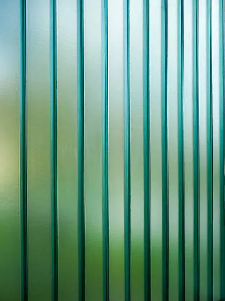 Green glass with a bokeh of a  green field