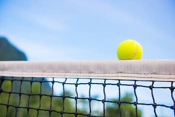 istock tennis ball with net 483510122