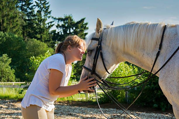 istock Horse and woman close 483510604