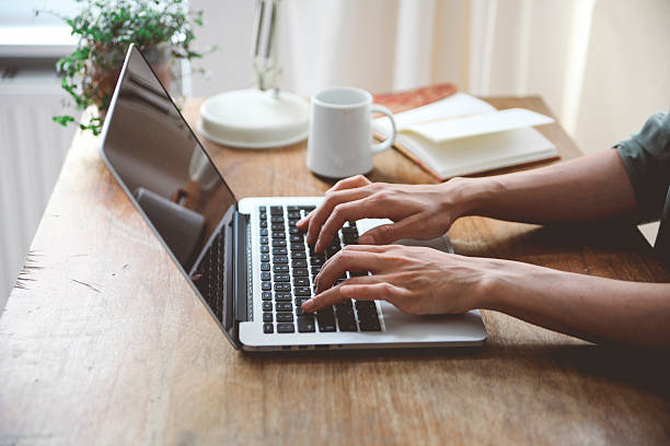istock Female novelist writing on the laptop 483511064