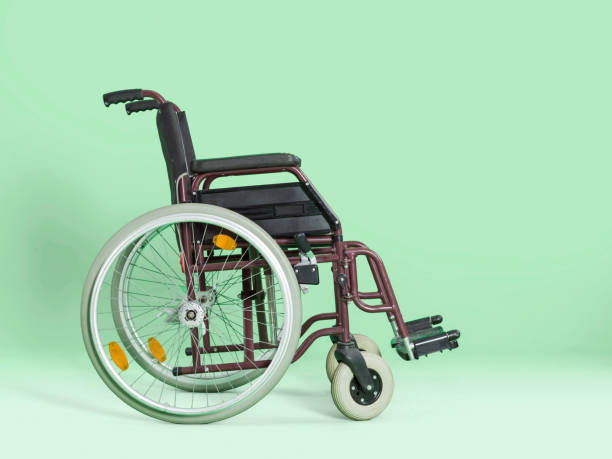 istock Wheelchair isolated on green background 483512160