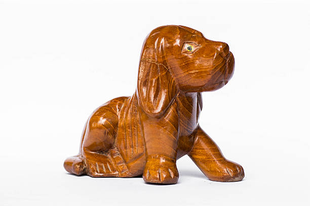 istock Wood carved dogs On a white background 483512292