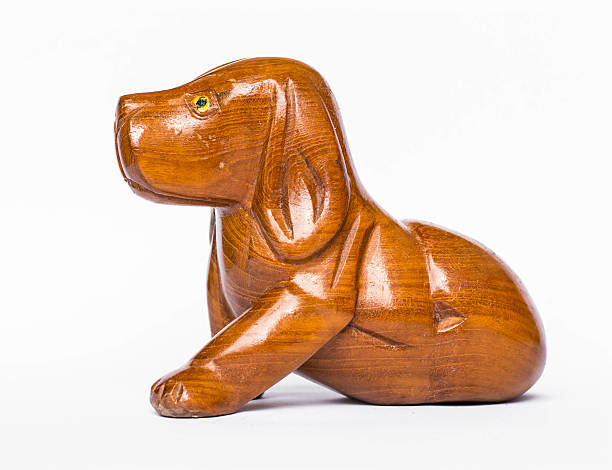 istock Wood carved dogs On a white background 483512294