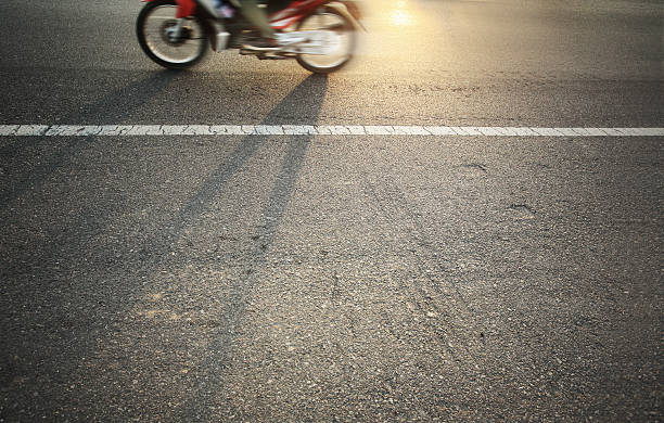 istock Motorcyclist on the road with white line. 483512338