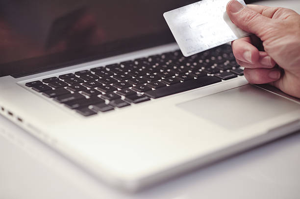 istock Close up of hands shopping online 483512434