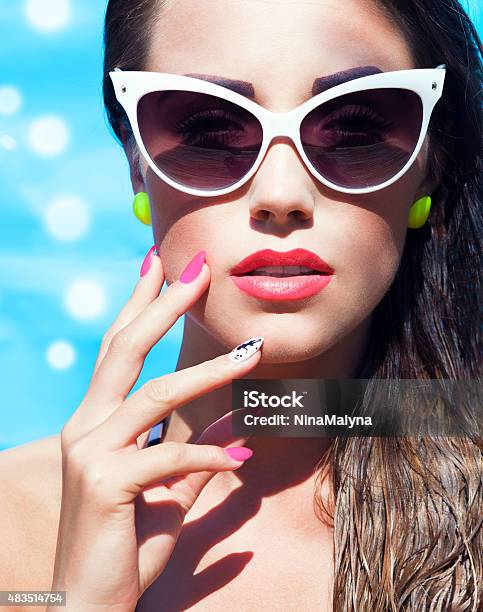 Colorful Portrait Of Young Attractive Woman Wearing Sunglasses Stock Photo - Download Image Now