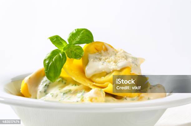Ricotta And Spinach Tortelloni With Cream Sauce Stock Photo - Download Image Now - 2015, Appetizer, Basil