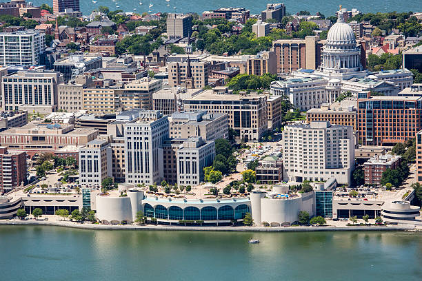 Downtown Madison from air with Monona Terrace and Capitol A tight view of the Wisconsin State Capitol and Monona Terrace taken from an airplane at 1000 feet.  lake monona photos stock pictures, royalty-free photos & images