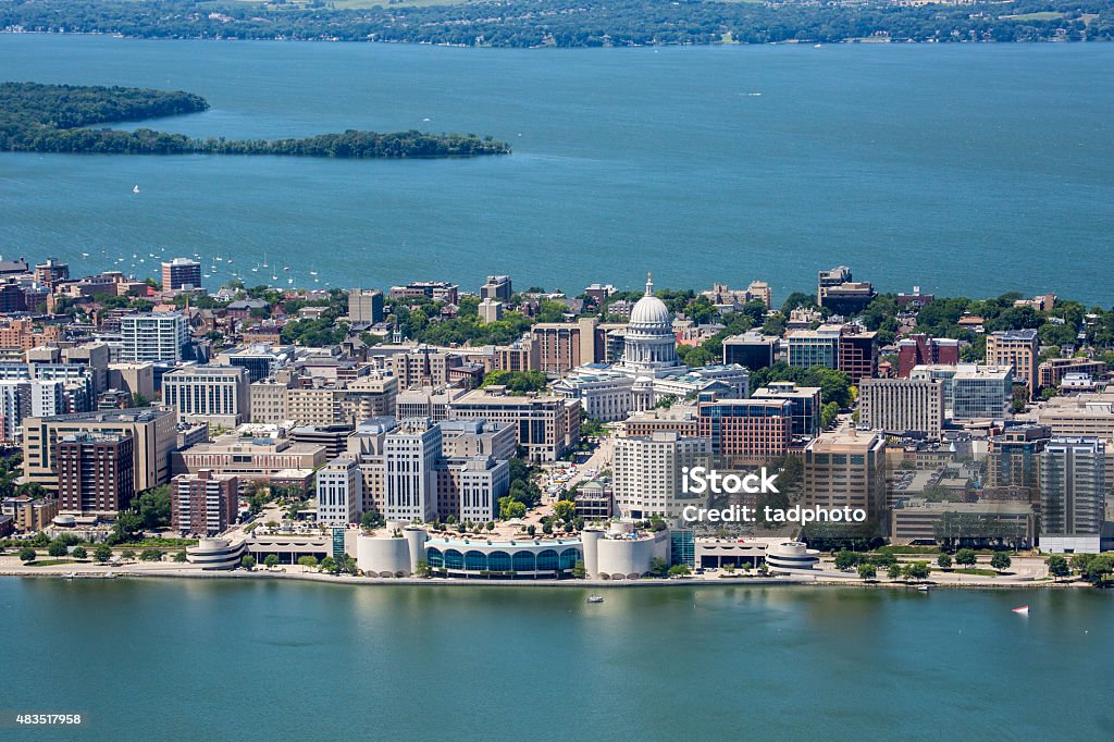 Downtown Madison Wisconsin Isthmus An aerial shot of the strip of Madison Wisconsin's downtown showing both the Monona Terrace and Capitol buildings as well as Picnic Point in the far background. Also shows parts of both Lakes Monona and Mendota.  Madison - Wisconsin Stock Photo