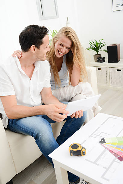 istock cheerful young couple making project to makeover their house 483518580