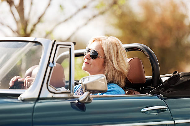 istock Mature woman in a cabriolet 483526469