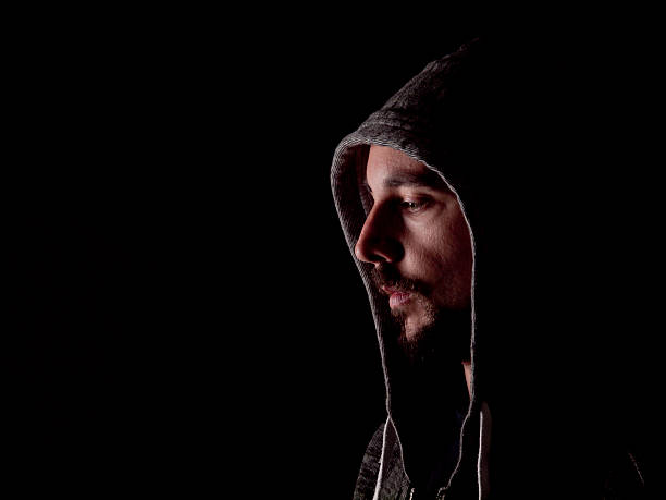 istock Low key image of a bearded man with hoody 483526627