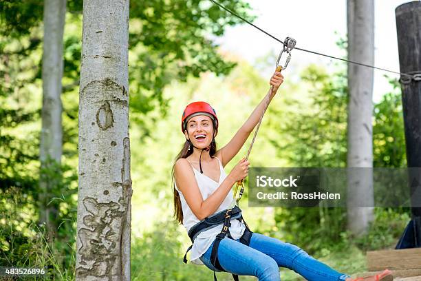 Woman Riding On A Zip Line Stock Photo - Download Image Now - Zip Line, Forest, Adult