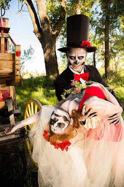 istock Characters: Skeleton bride wraps arms around groom. Spooky Halloween wedding. 483527185