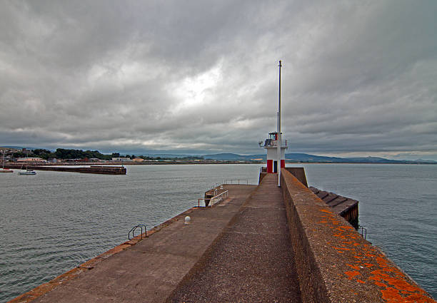 istock Wicklow Ireland Harbor - Jetty Breakwater Wall and Lighthouse 483527380