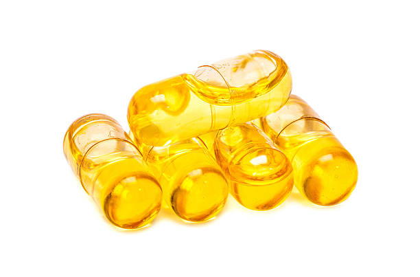 istock Fish oil capsules isolated on white background 483527782