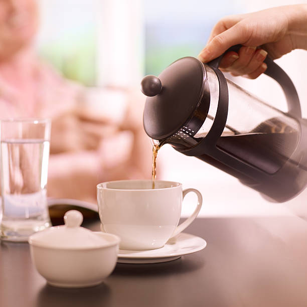 istock pouring a coffee from French press 483528293