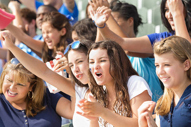 istock Fans at professional sporting event cheering in stands 483528487