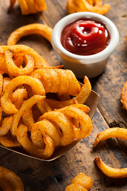 istock Spicy Seasoned Curly Fries 483530215