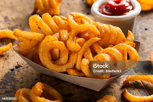 Spicy Seasoned Curly Fries Stock Photo - Download Image Now - Curly Fries, French Fries, Seasoning