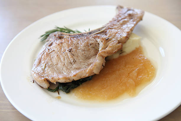 istock Grilled Porkchop on wood background 483530577