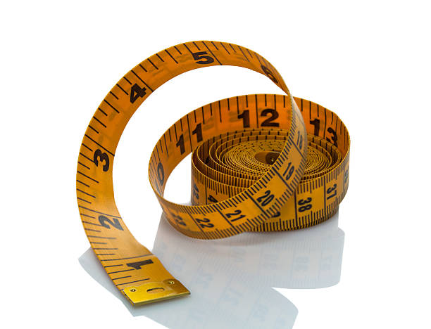 istock Rolled tape measure on white background 483530627
