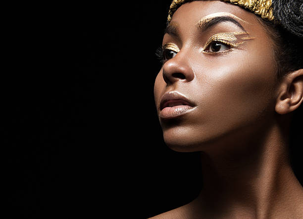 istock African girl with bright makeup and creative gold accessories on 483530816