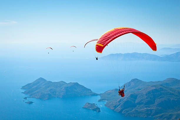Parachuting Paragliding at Fethiye Oludeniz. parasailing stock pictures, royalty-free photos & images
