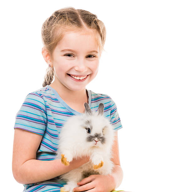 istock little girl with a rabbit 483531600