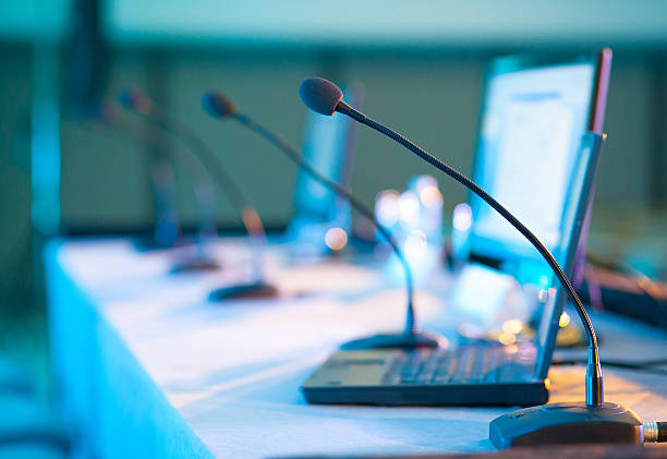 Conference microphone Conference microphones - Soft focus summit meeting stock pictures, royalty-free photos & images