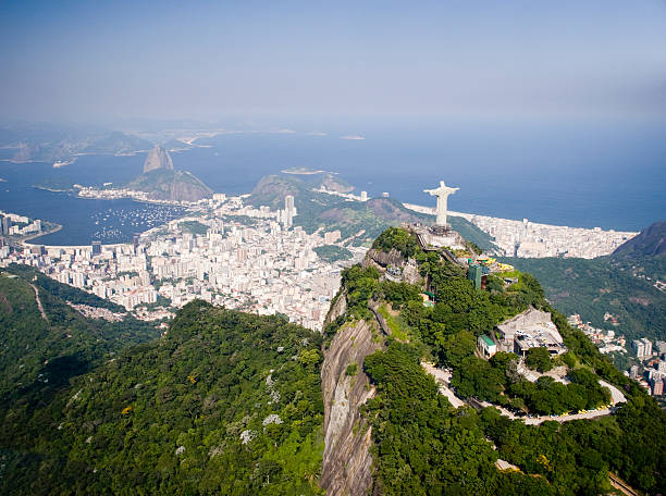 Aerial View of Rio de Janeiro in Brazil Aerial view of Corcovado and Sugar Loaf Mountain in Rio de Janeiro, Brazil.  cristo redentor rio de janeiro stock pictures, royalty-free photos & images