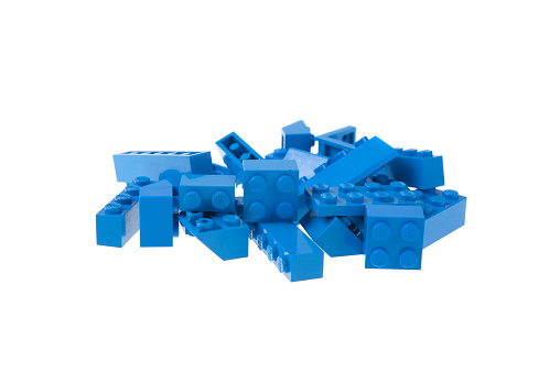 Adelaide, Australia - July 09, 2015: A studio shot of blue lego pieces, isolated on a white background. Lego is very popular with children and collectors worldwide.