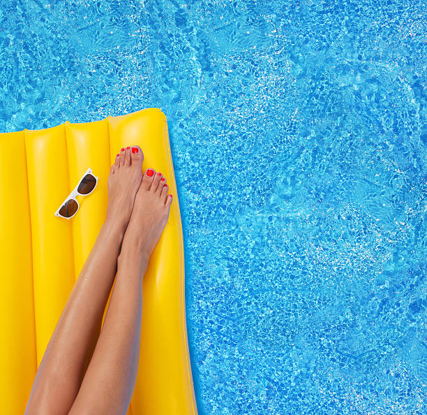 istock Woman relaxing in a pool 483536354