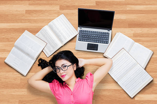 istock Pretty college student relaxing on the floor 483536926