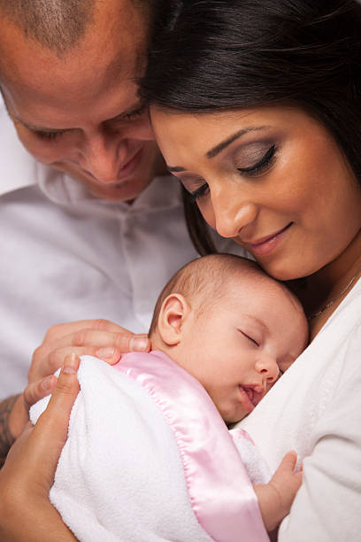 Mixed Race Young Family with Newborn Baby Happy Young Attractive Mixed Race Family with Newborn Baby. happy indian young family couple stock pictures, royalty-free photos & images