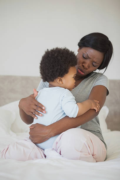 istock Mother consoling a little kid on bed 483545795