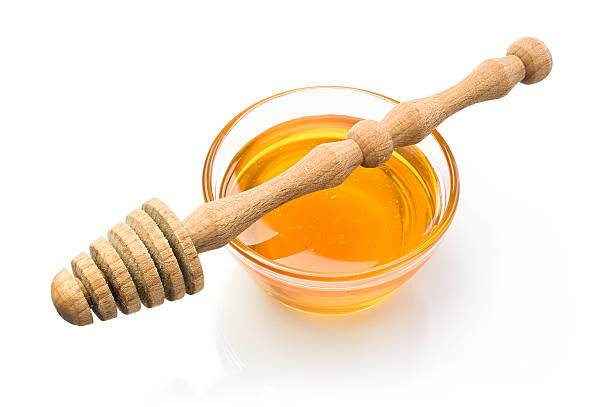 istock Honey with wooden dipper 483546318