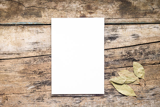 istock Blank White  Sketchpad with bay leaf on wooden background 483547289