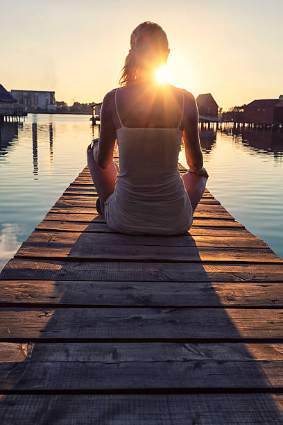 istock Young woman enjoying the sunset 483547697