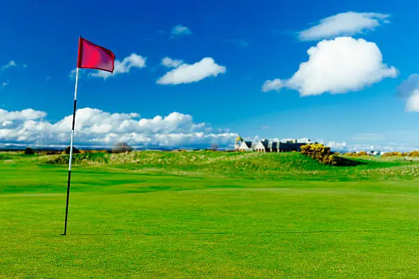 Golf flag on the putting green of the 17th hole on the Old Course at St.Andrews in Scotland. AdobeRGB colorspace.