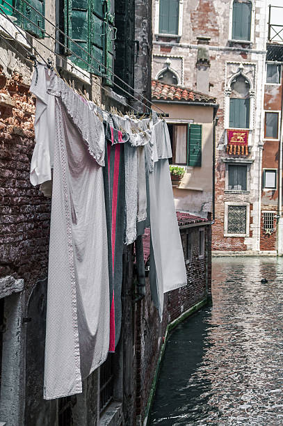 istock wet clothes hanging on a rope in Venice 483549558