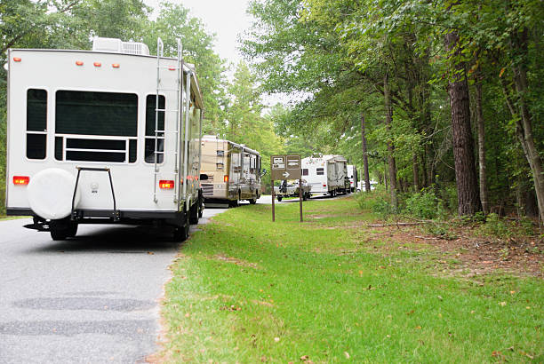 istock Line of recreational vehicles in public campground 483551568