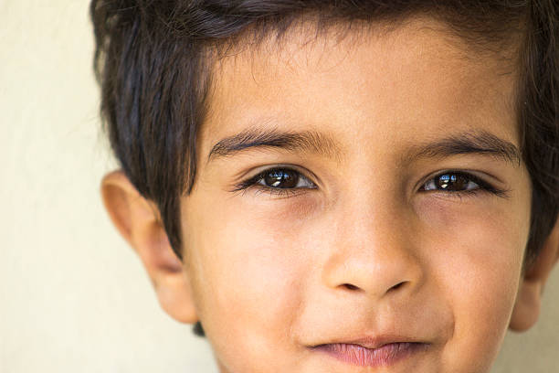 istock Portrait of smiling child against colored background 483552156