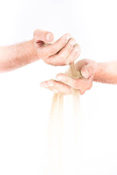 istock Sand in the hands. Isolated on a white background 483556720